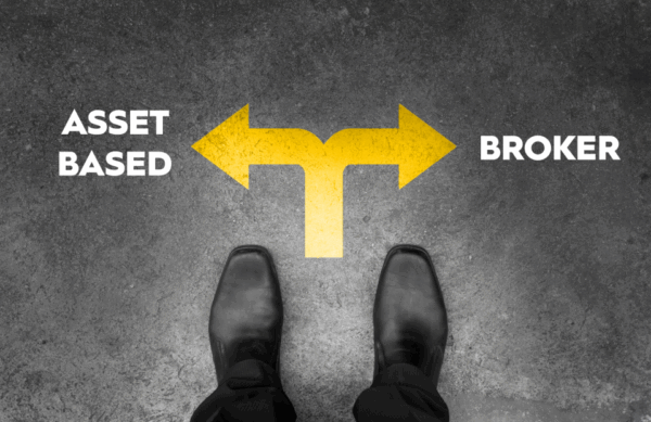 Man's shoes indicating he is looking down on the road at two arrows, one pointing towards asset-based and the other one pointing to broker